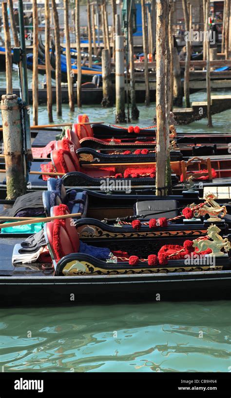 Elegant Gondolas Parked In A Port Near The San Marco Square In Venice