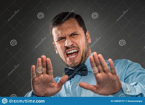 Portrait Angry Upset Young Man In Blue Shirt Butterfly Tie Stock Image