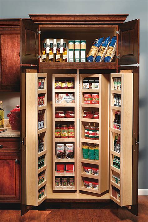 Hidden washer dryer door next to pantry cabinet alongside disguised washer and dryer and best laundry room colors. Tall Swing Out Pantry Cabinet - Decora Cabinetry