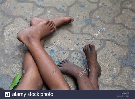Feet Of Poor Little Children Sleeping On The Pavement In