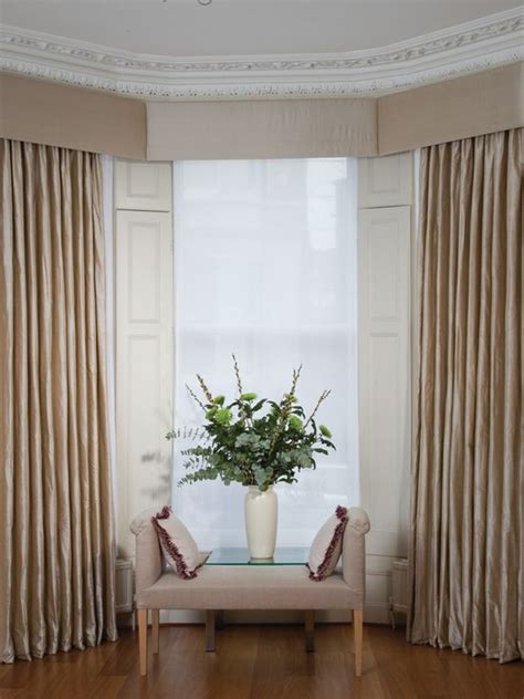Neutral Beige Silk Curtains In A Bay Window With Matching Upholstered