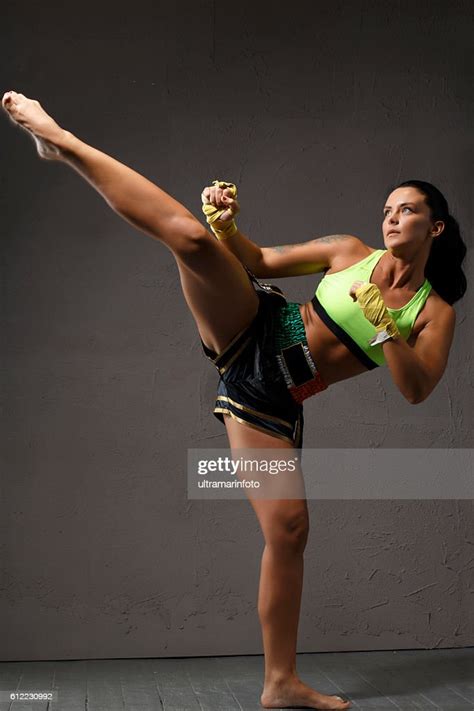 Female Kickboxing Athletic Woman Fighter Kicking Sports Training Photo