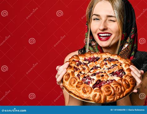 Portrait Of A Young Beautiful Blonde In Headscarf Holding A Delicious Homemade Berry Pie Stock