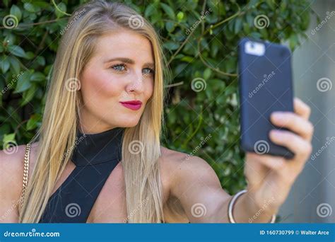 A Lovely Blonde Model Enjoys A Summers Day Outdoors At The Park Stock Image Image Of Blonde
