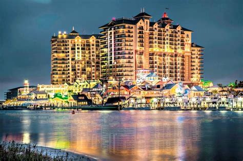 Emerald Grand And Harborwalk Village At Night With Lights Reflecting In