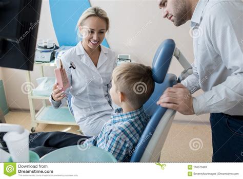 Friendly Dentist Working with Little Kid in Clinic Stock Image - Image