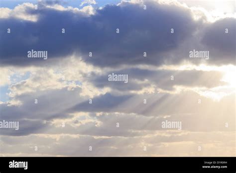 Sunlight Breaking Through The Clouds Stock Photo Alamy