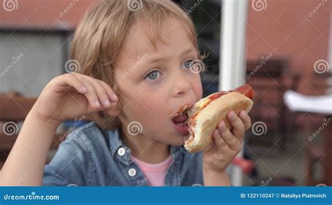 Two Boys In Denim Shirts Eating Delicious Hot Dog Stock Video Video