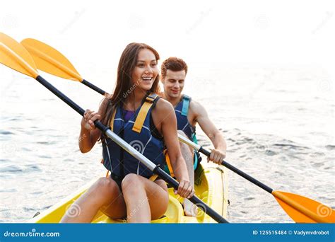 Beautiful Young Couple Kayaking On Lake Together Stock Photo Image Of