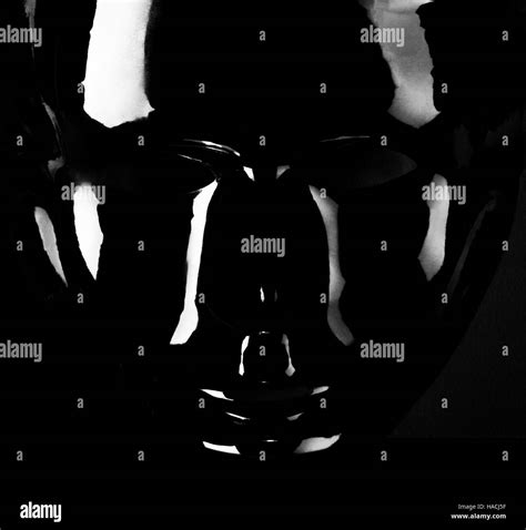 Shiny Black Mask Silhouette On Pitch Black Background Stock Photo Alamy