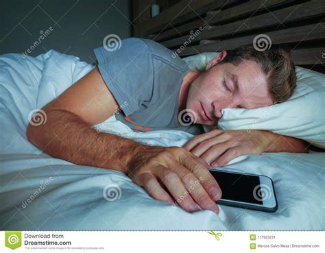 Attractive And Handsome Tired Man On His 30s Or 40s In Bed Sleeping