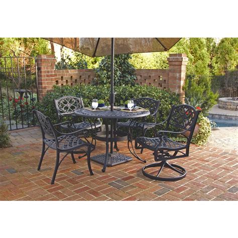 What's also super attractive about this outdoor dining table is the low cost. 48-inch Round Black Metal Outdoor Patio Dining Table with ...