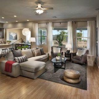 Two large, low ottomans double as coffee tables and. Living room beige and grey combo-I like this layout ...
