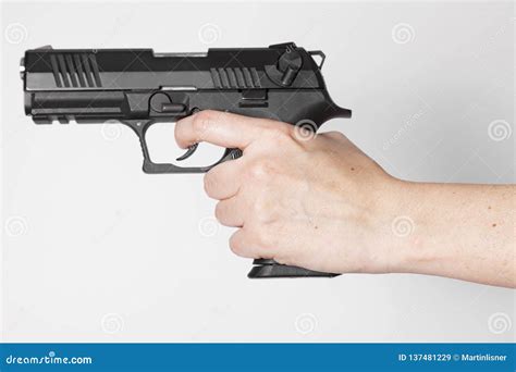 Hand Holding A Gun Stock Image Image Of Backgroundn 137481229