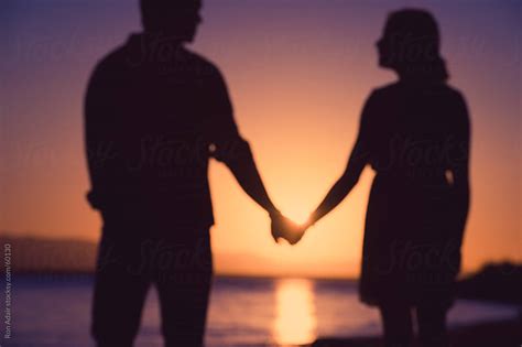 Love Young Couple In Love Holding Hands By Ron Adair Stocksy United