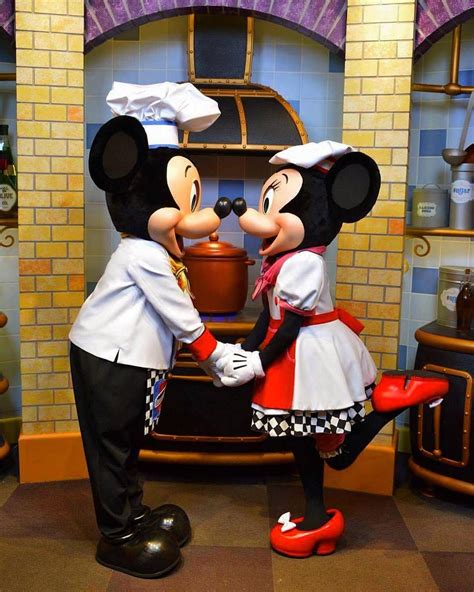 Mickey And Minnie Nose Kissing While Working In Goofys