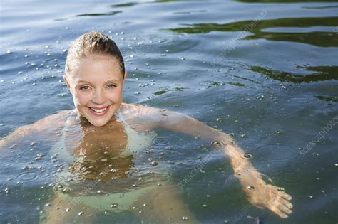 Smiling Woman Swimming In Lake Stock Image F Science Photo Library