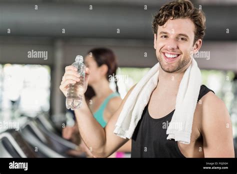 Athletic Man Drinking Water While Running On Treadmill Stock Photo Alamy
