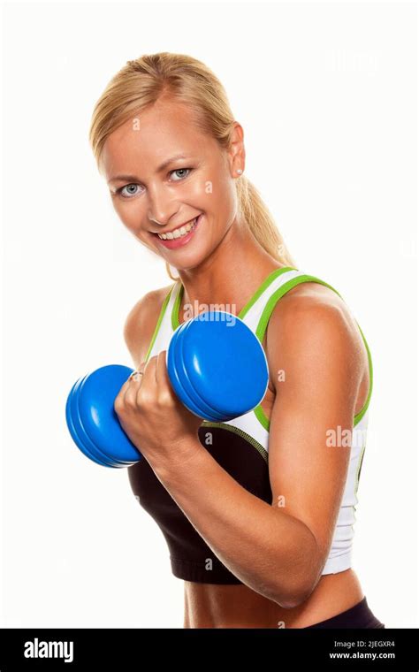 Eine Junge Blonde Frau Trainiert Mit Einer Hantel Im Fitnessstudio Fitness Studio Stock Photo