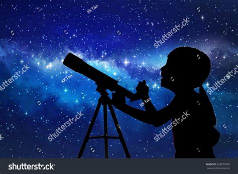 Silhouette Of Little Girl Looking Through A Telescope At The Stars