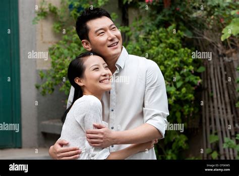Young Chinese Couple Embracing Stock Photo Alamy