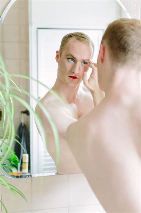 Non Binary Guy Doing Their Makeup By Stocksy Contributor Kkgas
