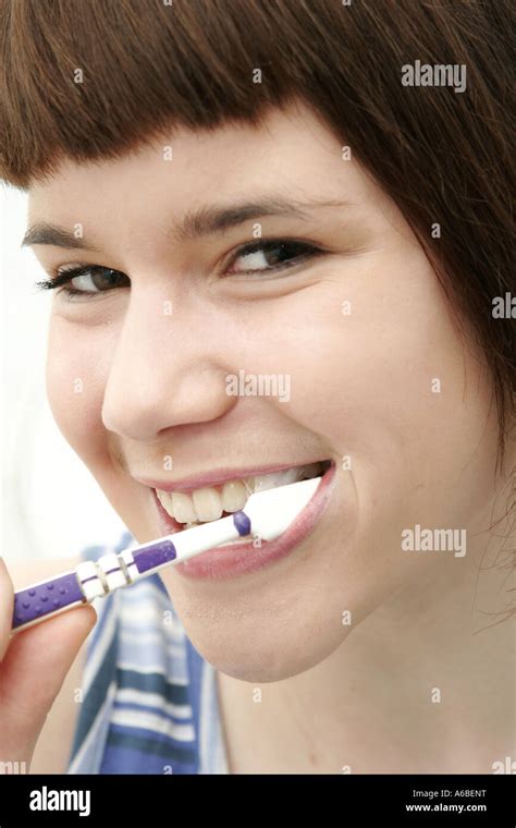 Woman Brushing Her Teeth Stock Photo Alamy
