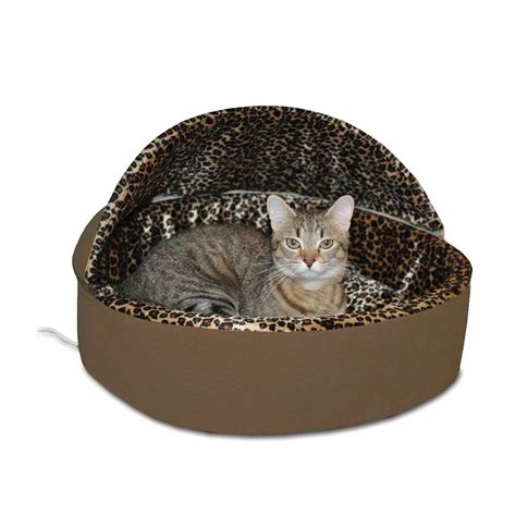 A Cat Laying In A Leopard Print Pet Bed