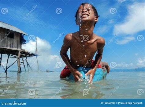 Bajau Tribal Kids Having Fun By Jumping Into Sea From Their Boat Sabah