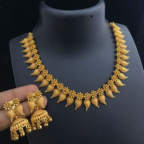 The yellow metal is never outdated in the fashion industry and a simple chain design in gold can be styled for women in a variety of motifs. Designer Light Weight Gold Necklace for Women - Kurti Blouse