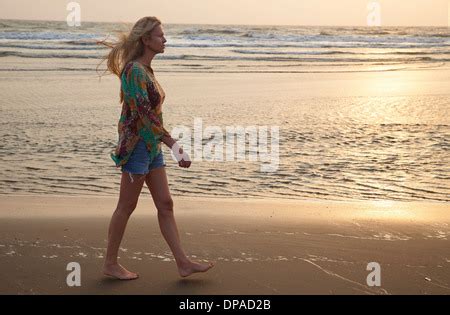 Nude Woman Walking On Beach Stock Photo Alamy