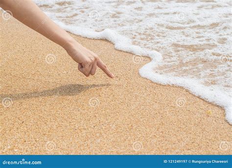 woman`s finger is drawing on beach sand stock image image of sand shape 121249197