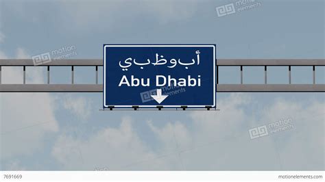 4k Passing Abu Dhabi Uae Highway Road Sign With Matte 1 Neutral Stock