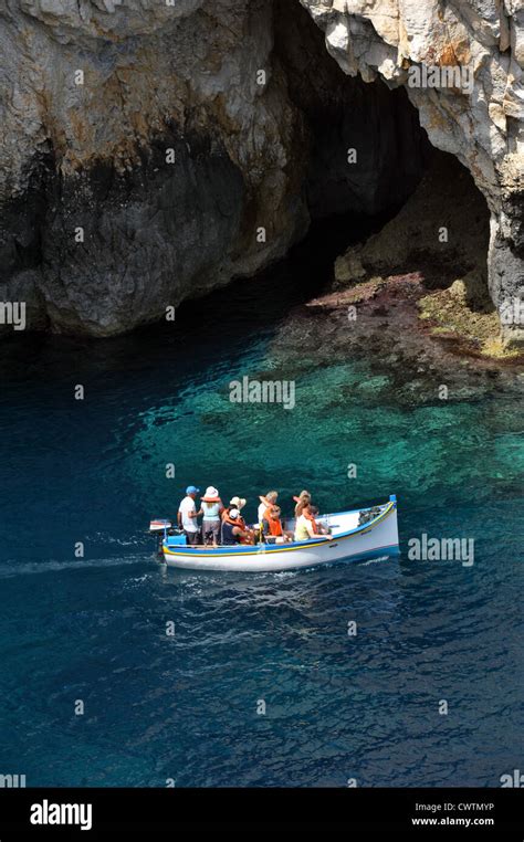 Tourist Boat In The Blue Grotto Sea Caves In Malta Stock Photo Alamy