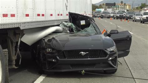 Watch Workers Pull Out A Mustang Trapped Under Big Rig After Horrific