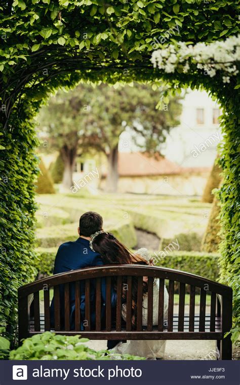 The Magnificent View Of The Newlywed Couple Spending Time In The Garden