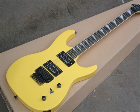 Yellow Electric Guitar With H H Pickupsrosewood Fingerboardtremolo