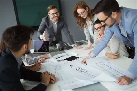 Group Of Business People Collaborating In Business Office Stock Photo