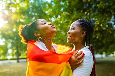 brazilian lesbian couple in white dress spending time together celebrating engagement in summer