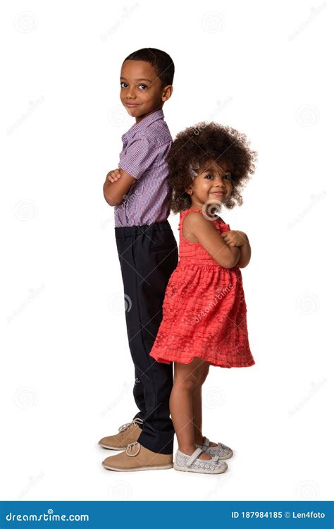 Two African American Siblings In Full Length Standing Back To Back With