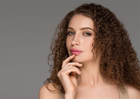 Premium Photo Curly Long Brunette Hair Woman Touching Face Beauty