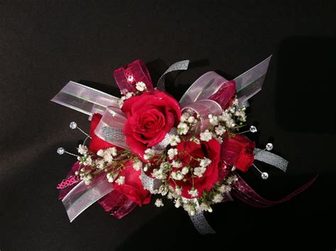 Wrist Corsage Of Red Spray Roses Babies Breath Sparkling Gems And