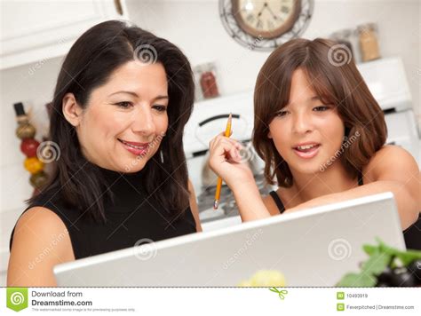 Attractive Hispanic Mother And Daughter Using Laptop Stock Image Image Of Beauty Brown 10493919