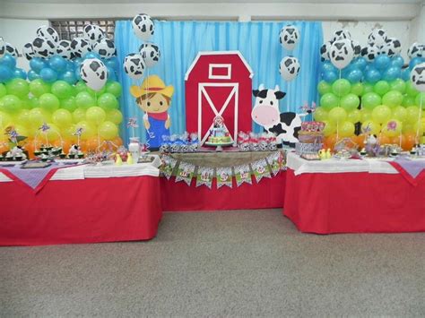 A Room Filled With Lots Of Balloons And Tables Covered In Animals Farm