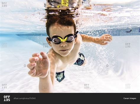 Portrait Of Shirtless Boy Swimming Underwater In Pool Stock Photo OFFSET