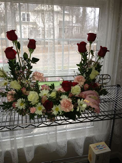 We provide the finest in flowers, blooming & green plants, hanging baskets and gifts. Perfect for a Memorial service, this beautiful arrangement ...
