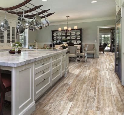 Wood floor with tile inlay in kitchen. Flooring | Florida Design Works | Wood tile floor kitchen ...