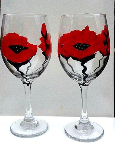 Two Wine Glasses With Red Flowers Painted On Them