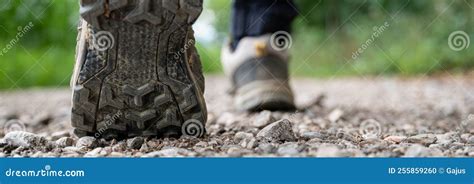 Closeup Wide View Image Of Male Feet In Hiking Shoes Walking On A