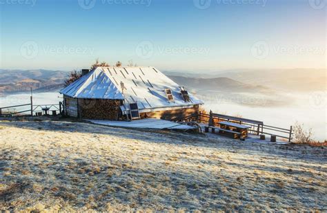Cabin In The Mountains In Winter Mysterious Fog In Anticipatio